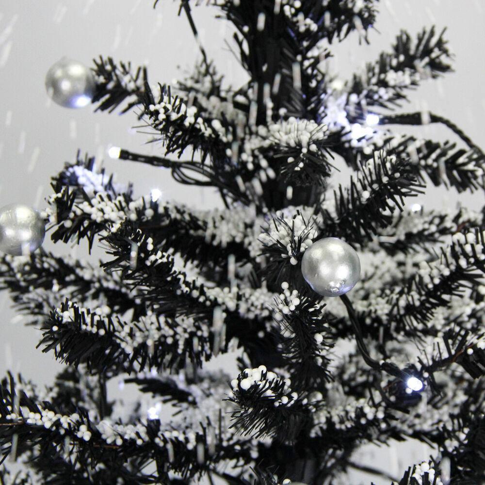 29 in. Black Christmas Tree with Star Topper and Umbrella Base